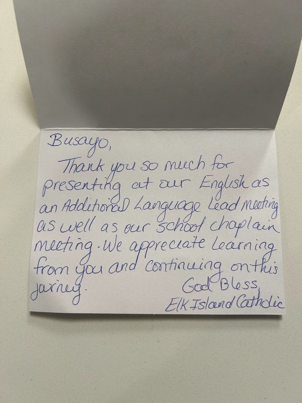 Handwritten card from Elk Island Catholic: Busayo, thank you so much for presenting at our English as an Additional Language lead meeting as well as our school chaplain meeting. We appreciate learning from you and continuing on this journey. God bless, Elk Island Catholic.