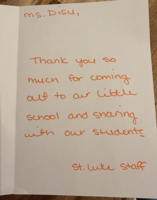 Handwritten card from St. Luke staff: Ms. Disu, thank you so much for coming out to our little school and sharing with our students. St. Luke staff.